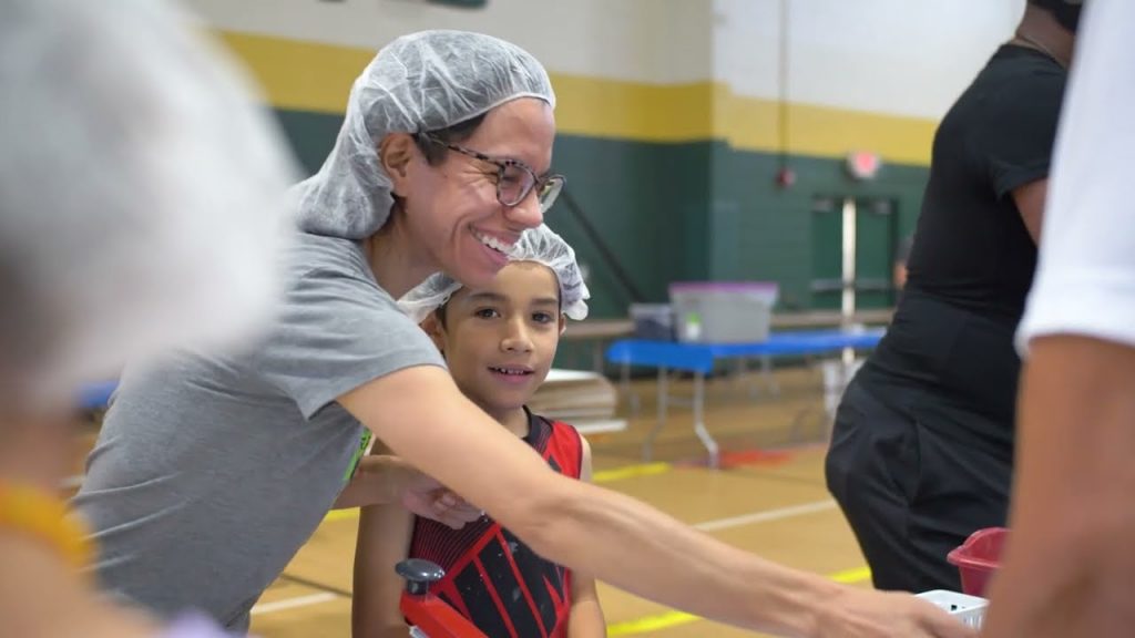 woman and child smiling be your own boss with meals of hope