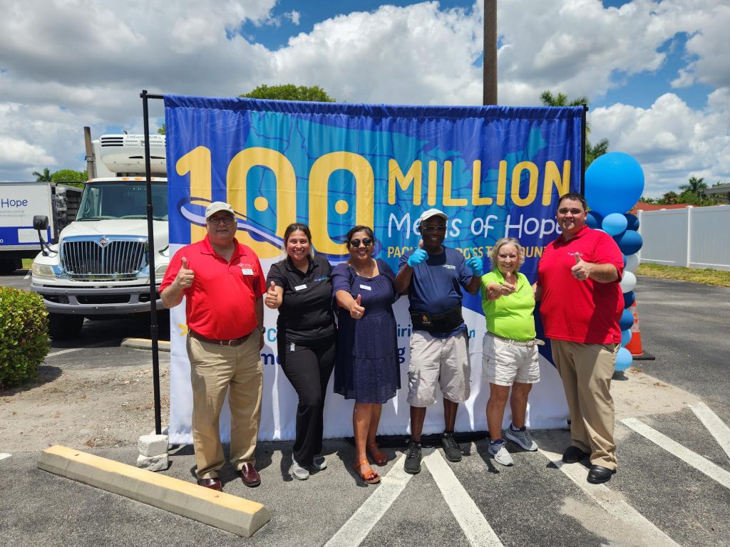 Celebrating 100 million meals packed at a local packing event